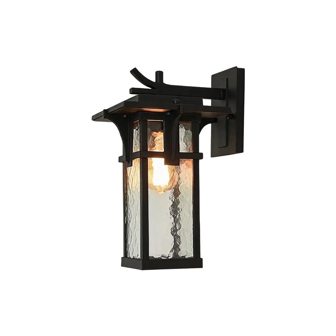 Vintage sconce wall light featuring a black metal frame and warm candle-style illumination.