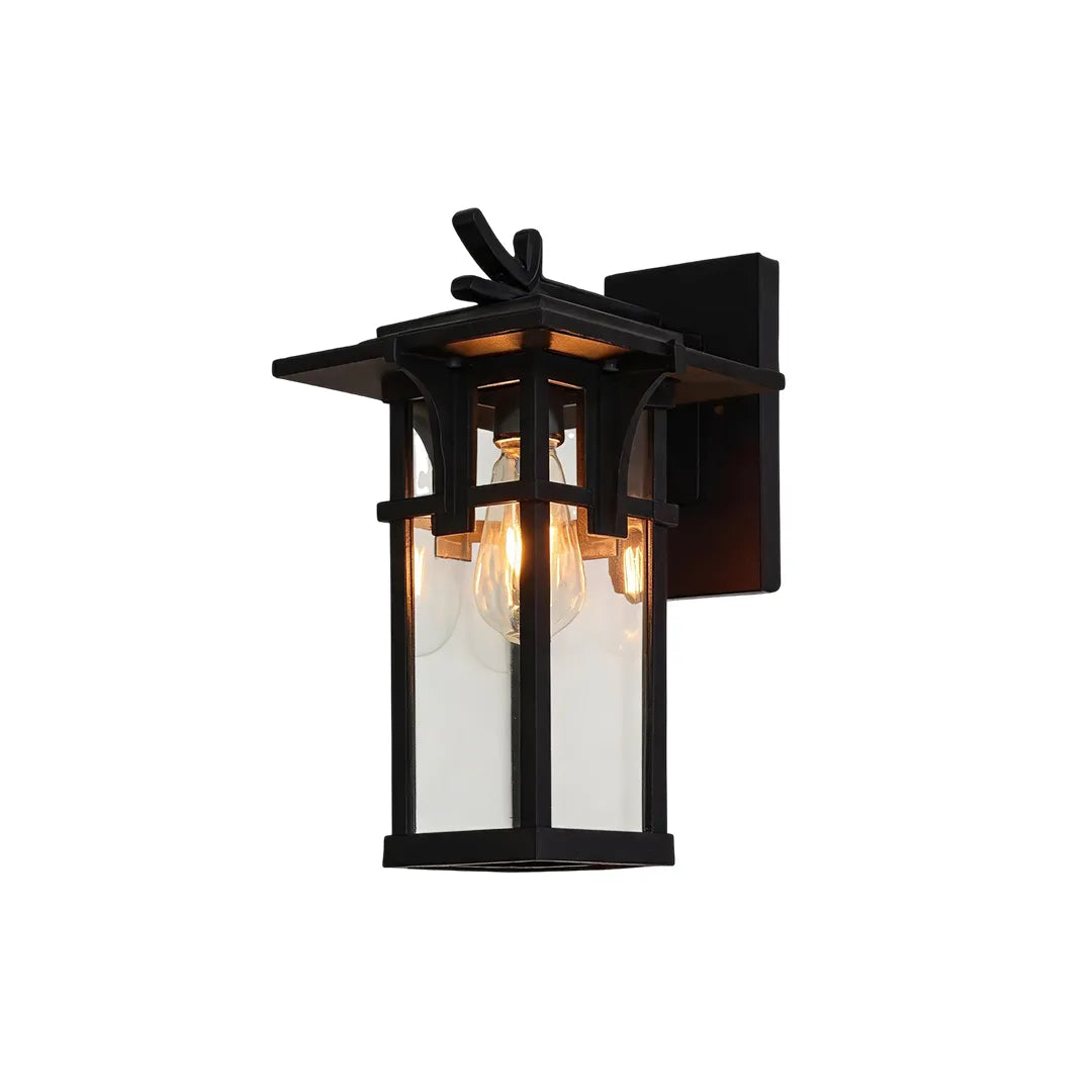 Vintage sconce wall light with a dark finish, curved arm, and traditional lantern silhouette.