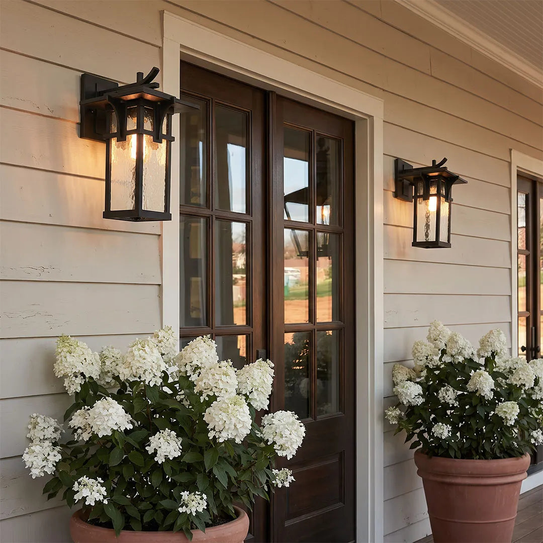 Vintage sconce wall light installed beside a front door for warm and welcoming exterior lighting.