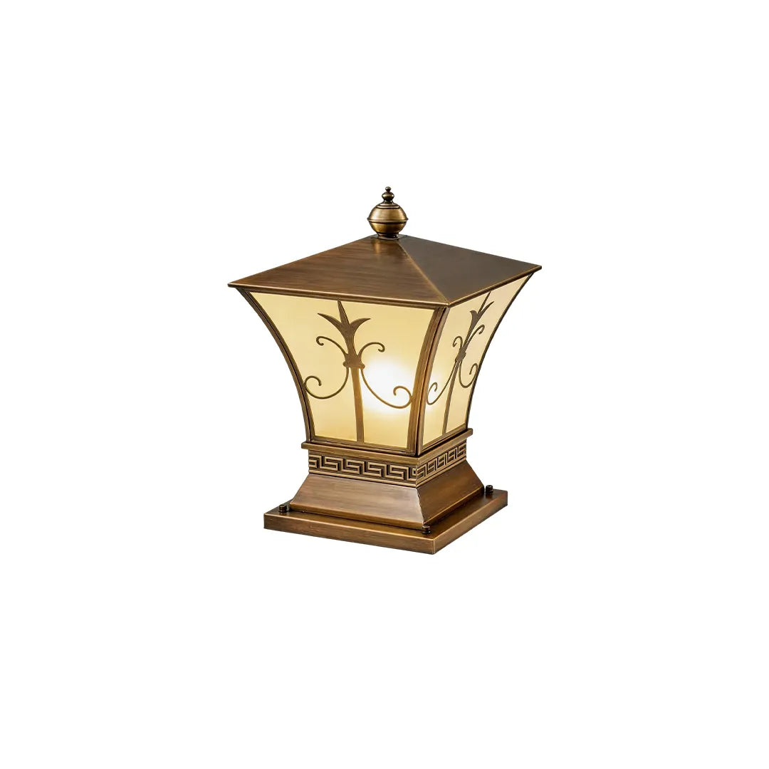 Vintage solar pillar lantern with antique bronze frame and warm illuminated glass