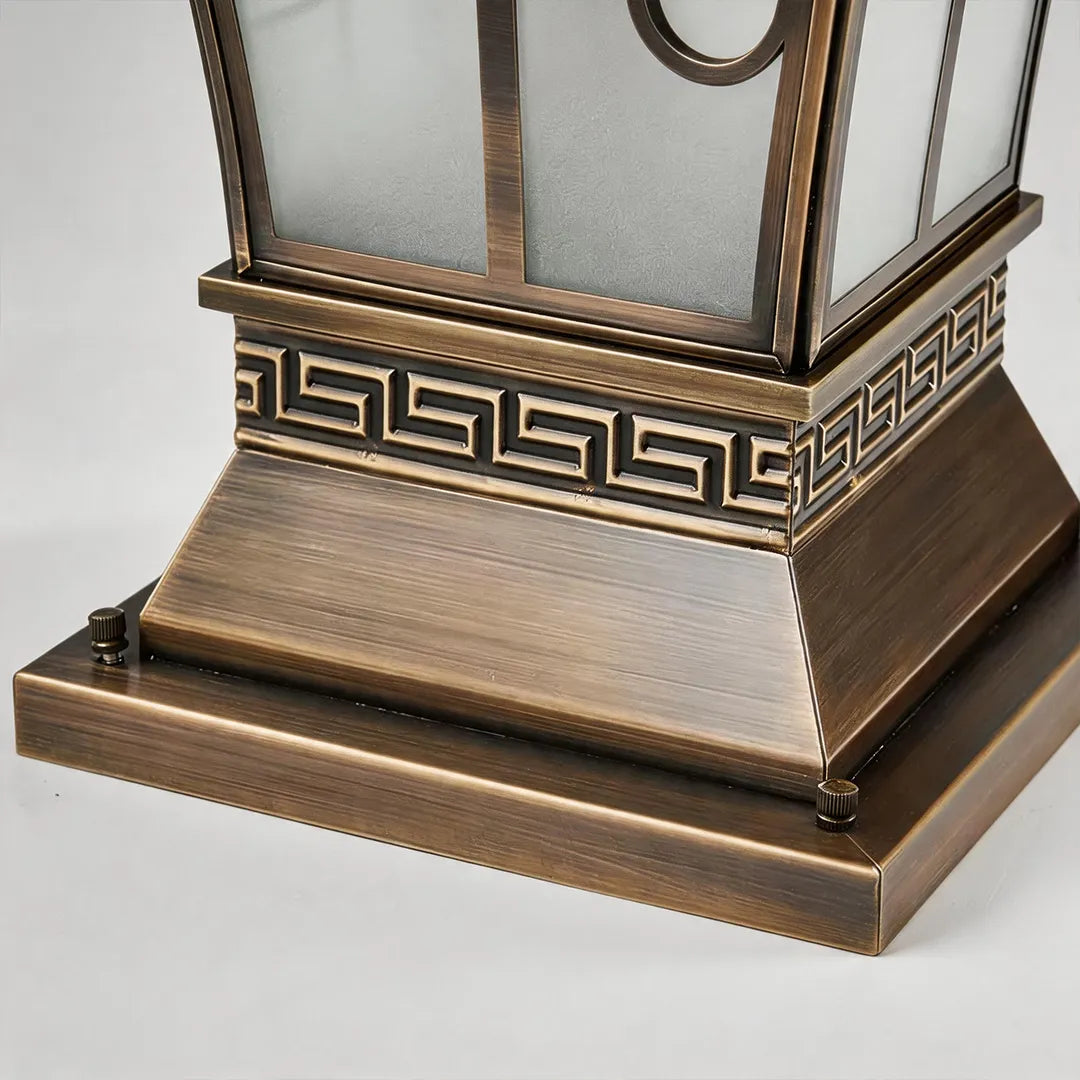 Vintage solar pillar lantern with antique bronze base and Greek key pattern detail