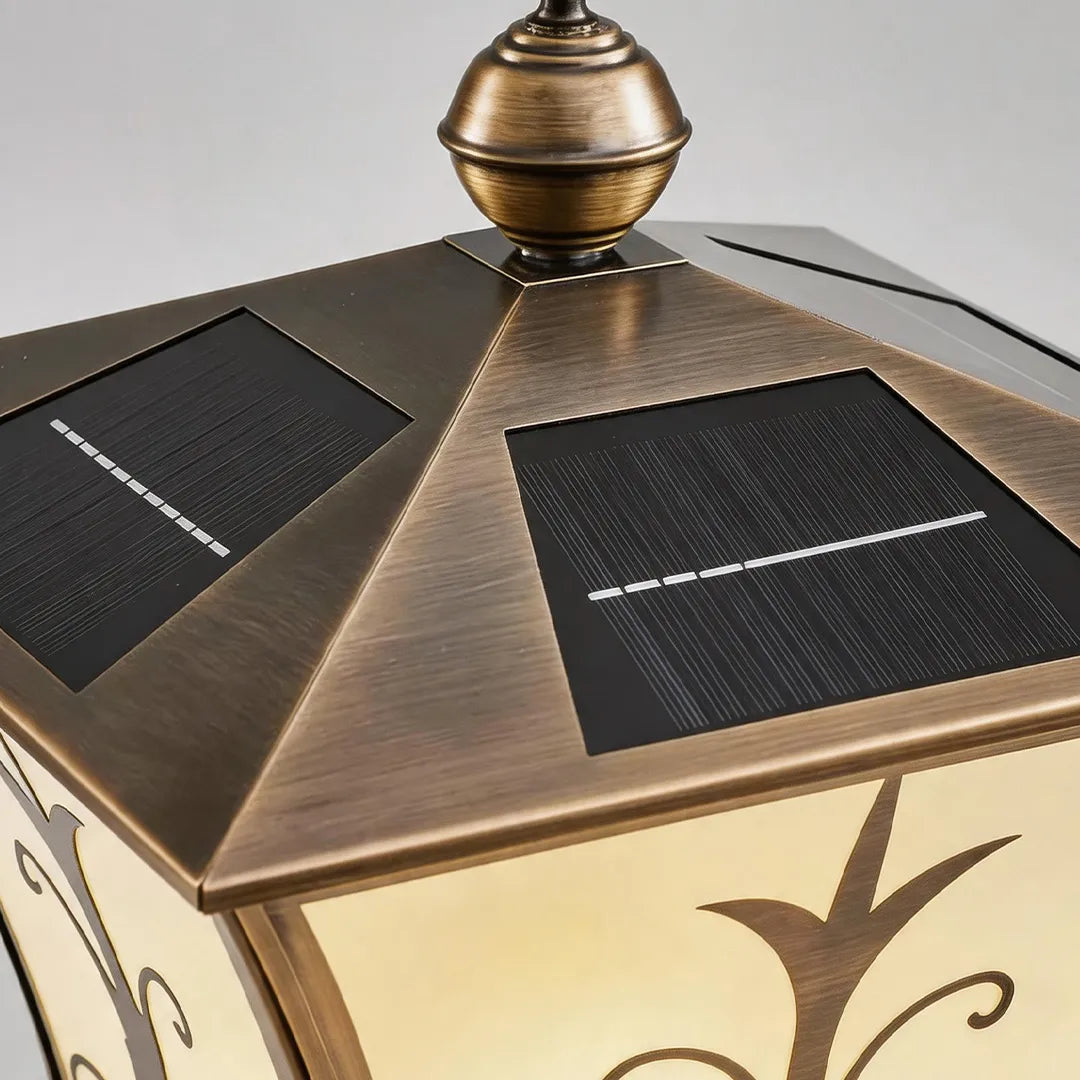 Vintage solar pillar lantern with bronze metal roof and integrated solar panels