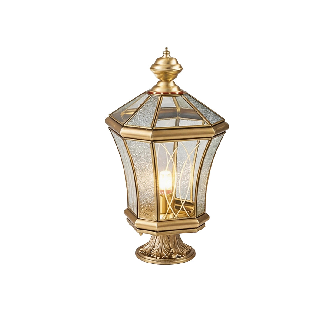 Vintage solar pillar lantern with gold finish and warm illuminated glass