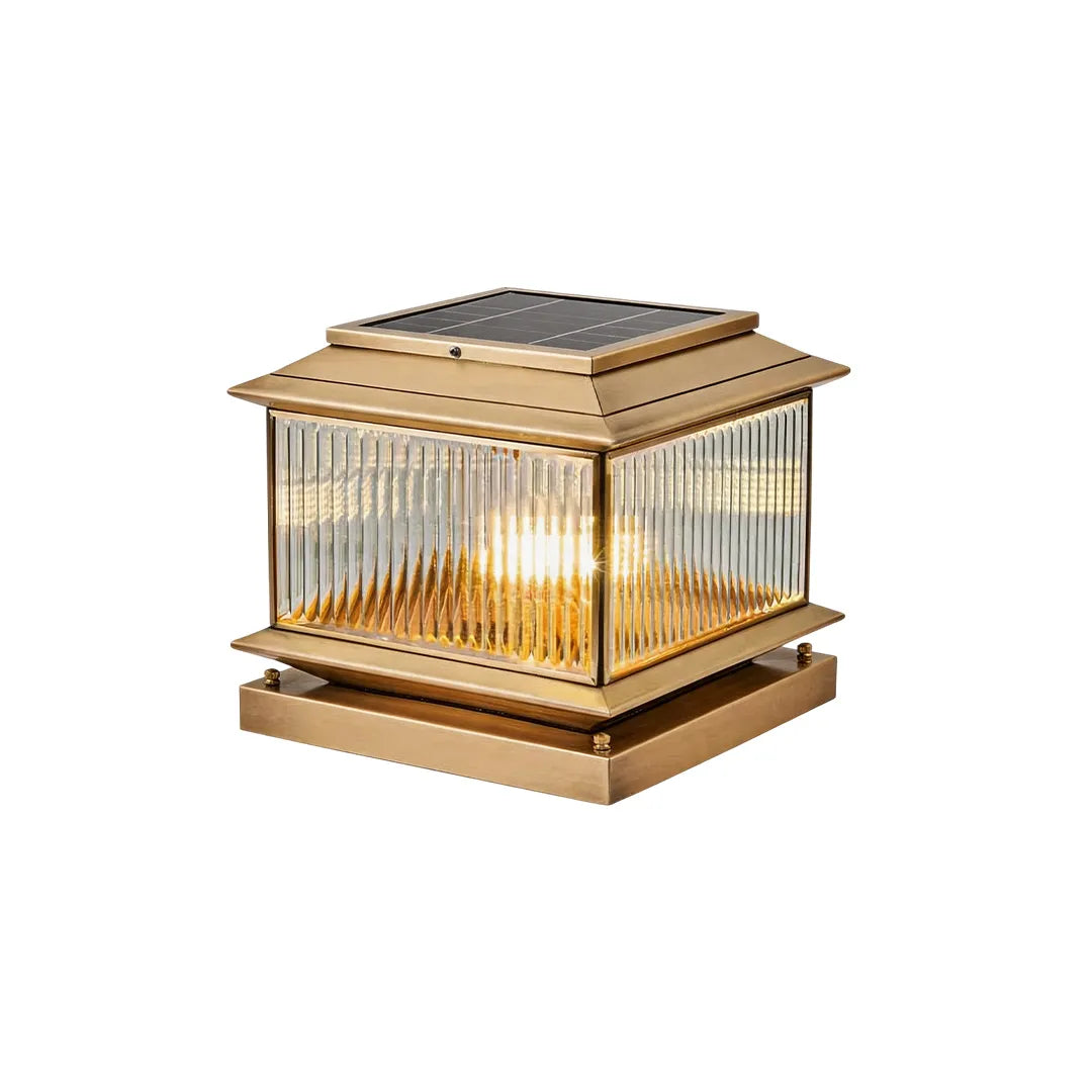 Vintage solar pillar light with antique brass frame ribbed glass and warm glow