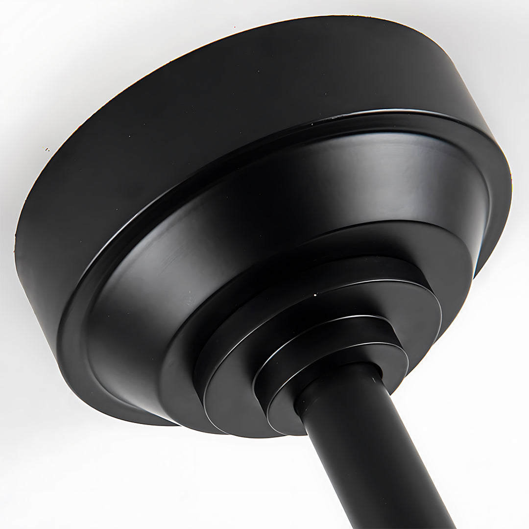 Vintage style ceiling fan motor detail showing black finish and circular housing construction
