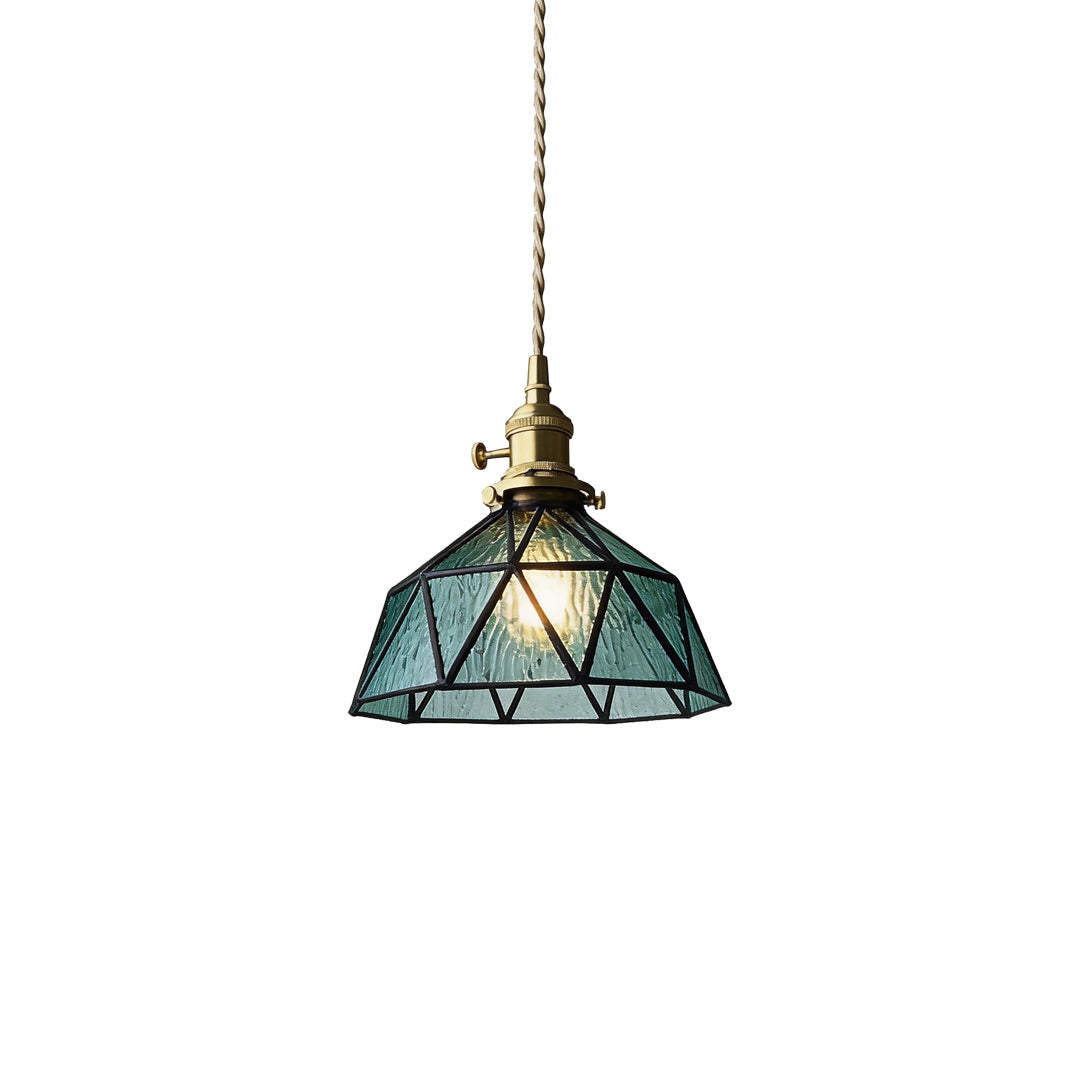 Vintage teal glass amber indoor pendant light with brass hardware and geometric pattern.
