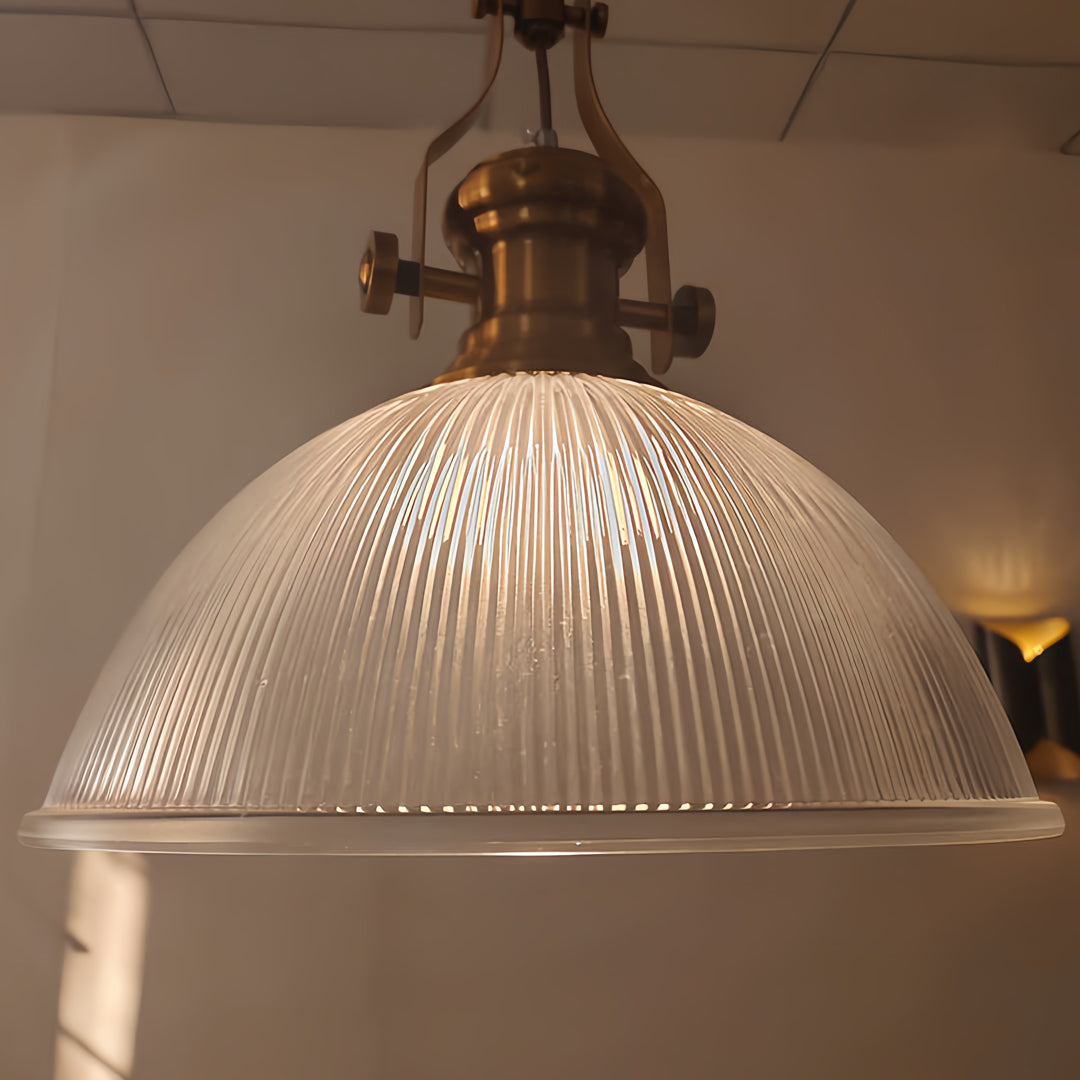 Vintage textured glass pendant light with amber-tinted ribbed shade and antique brass hardware for classic decor