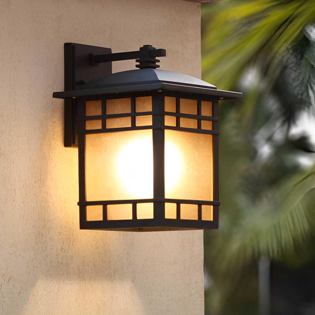 Vintage wall lantern with a black finish, providing ambient light near a window.