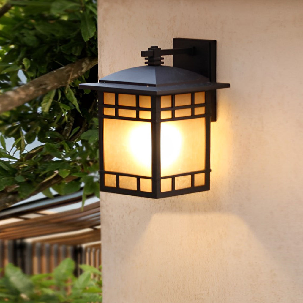 Vintage wall lantern with a close-up of its detailed metalwork and glass.