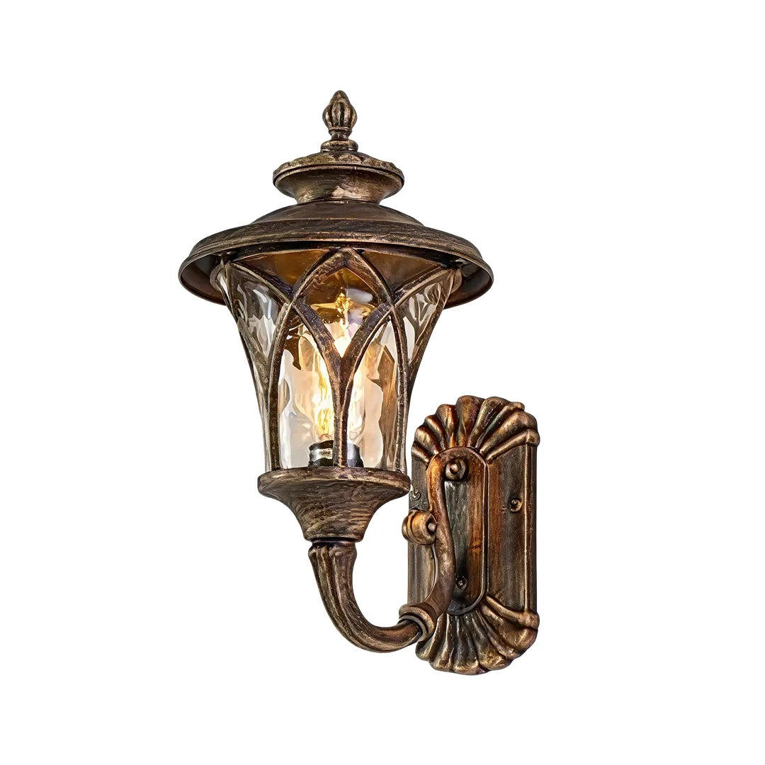 Vintage wall sconce light fixtures with an antique bronze finish and decorative curved lantern frame.