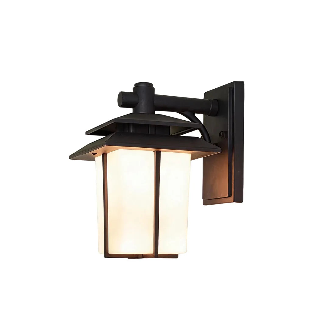 Vintage wall sconce light fixtures with a matte black frame and softly illuminated glass panels.