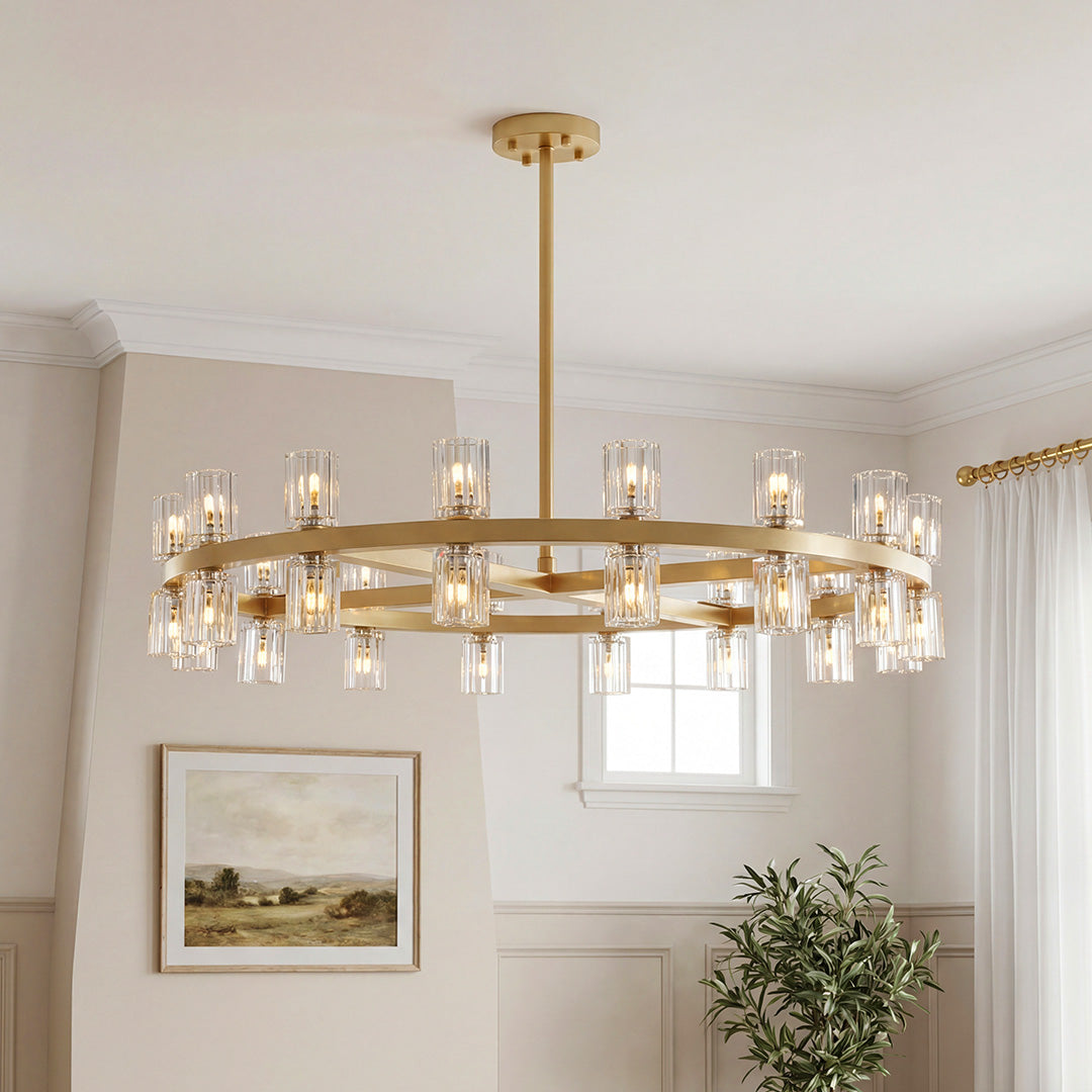 Stunning large wagon wheel luxury crystal chandeliers featuring a gold frame and ribbed cylindrical glass shades in an elegant living space.