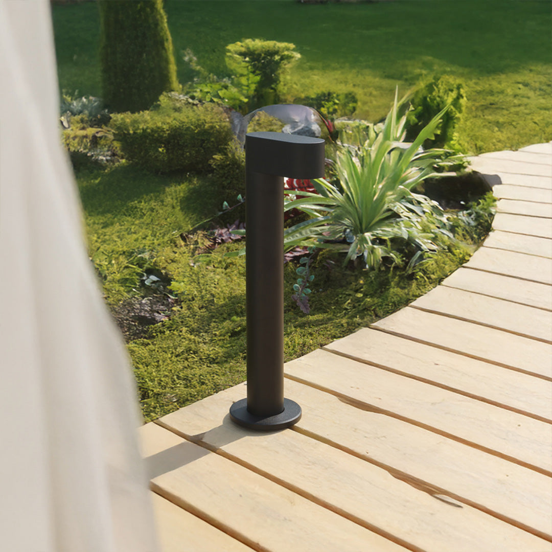 Multiple LED path lights creating illuminated walkway through residential outdoor space with modern design