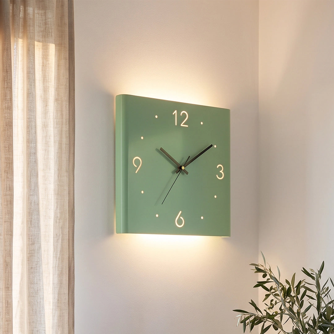 Green wall clock lamp mounted on a wall, glowing softly beside a window and beige curtains.