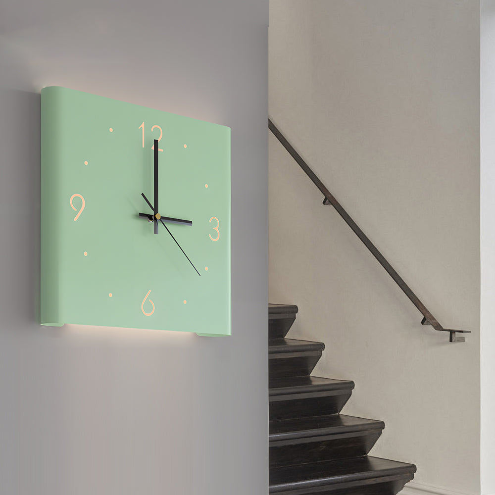 Wall clock lamp installed near staircase creating subtle accent light