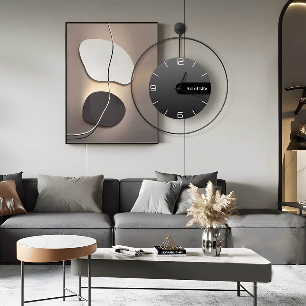 Wall clock light with orange and black accents, displayed on a light gray wall.