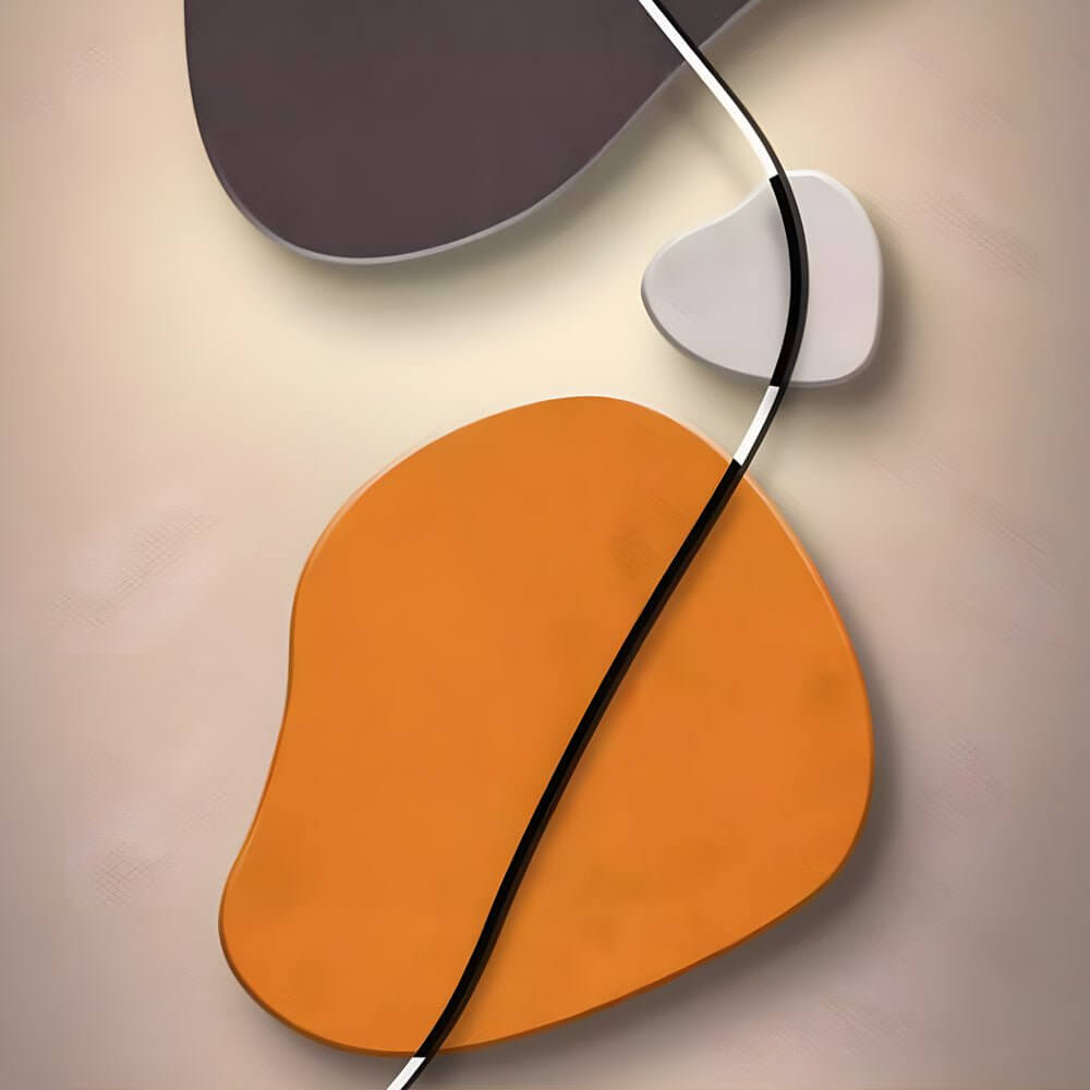 Wall clock light with orange and white shapes, mounted on a neutral wall.