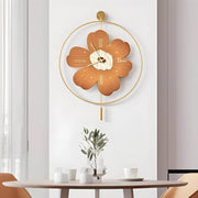 Wall clock with light adding a floral touch to a modern dining room with wooden furniture.