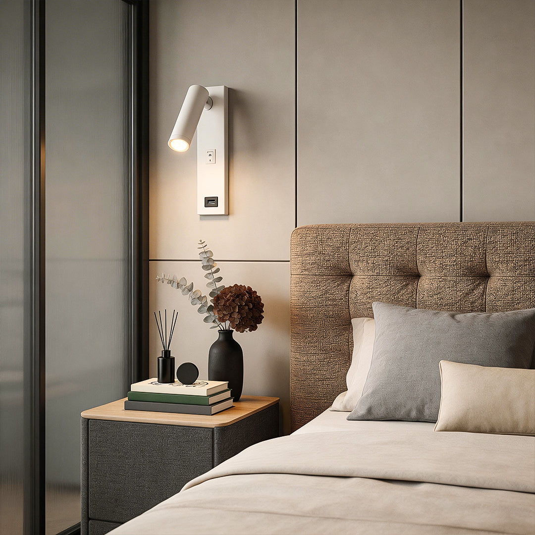Wall lamp with USB charger illuminating a modern bedroom with warm directional glow.