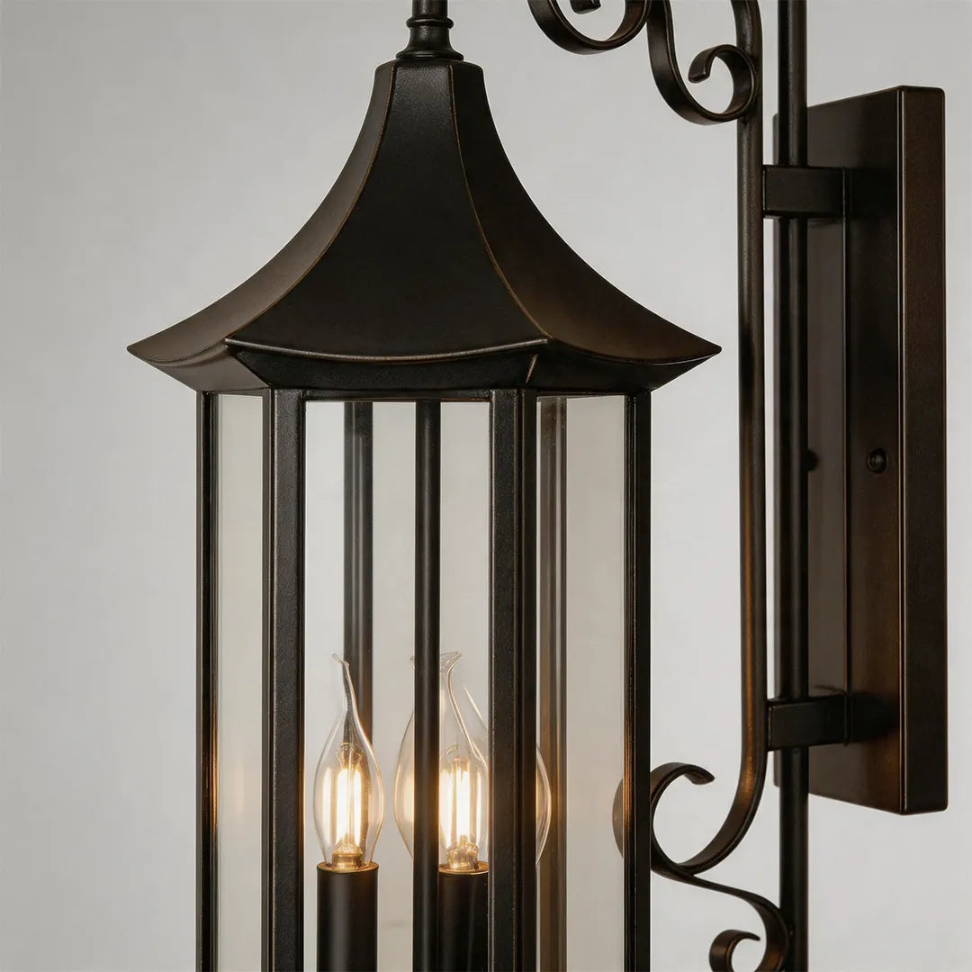 Wall lanterns outdoor lighting product detail with clear glass panels, bronze finish, and three candle-style bulbs.