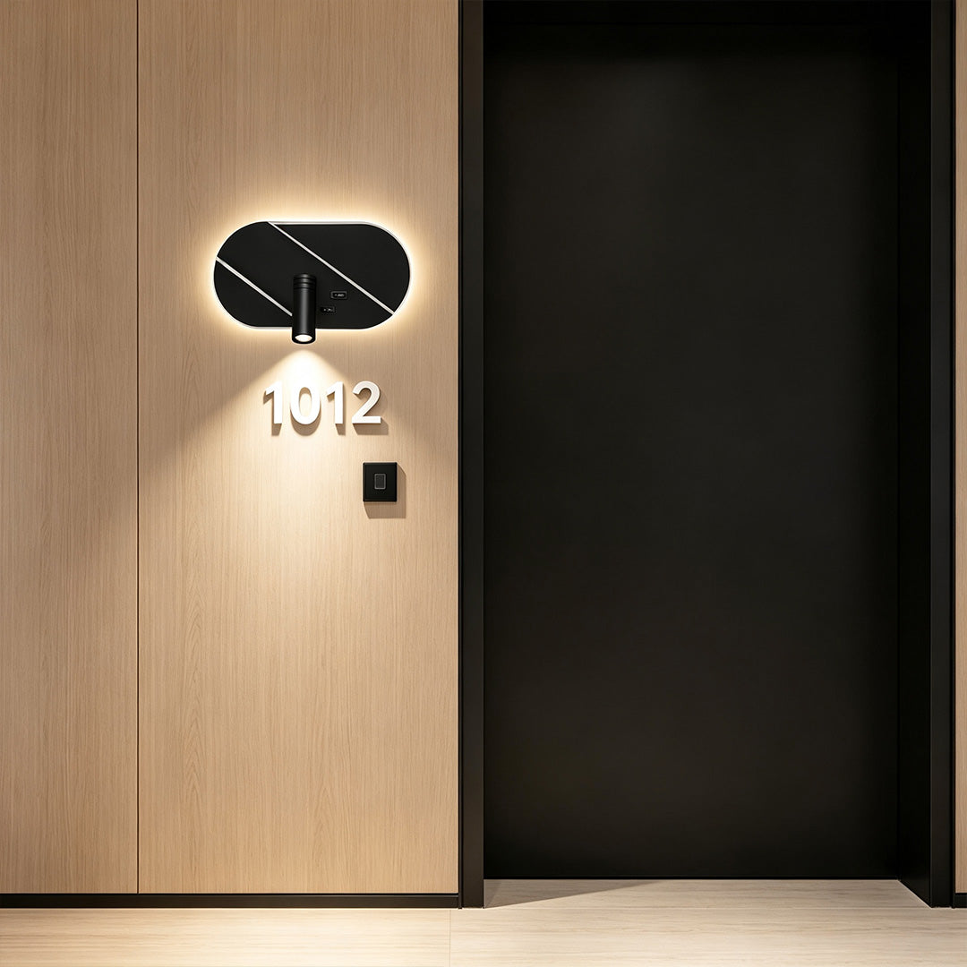 Elegant wall light with reading light mounted beside doorway with decorative ambient LED backlighting.