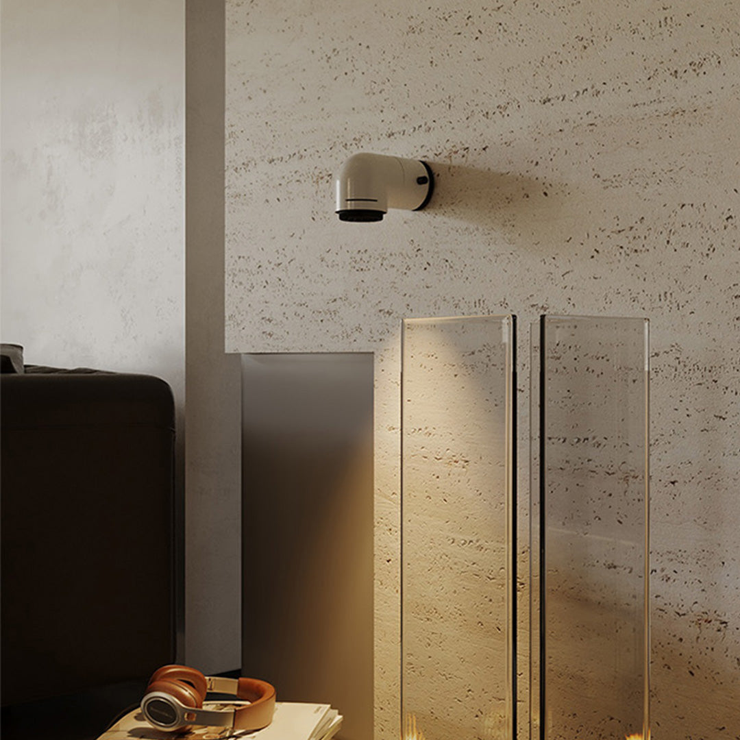 Red wall modern light used as an accent fixture on a clean white wall surface.