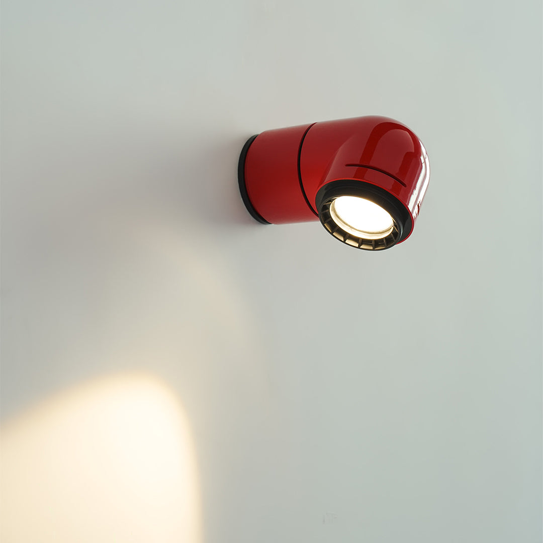 Red wall modern lights used as an accent fixture on a clean white wall surface.