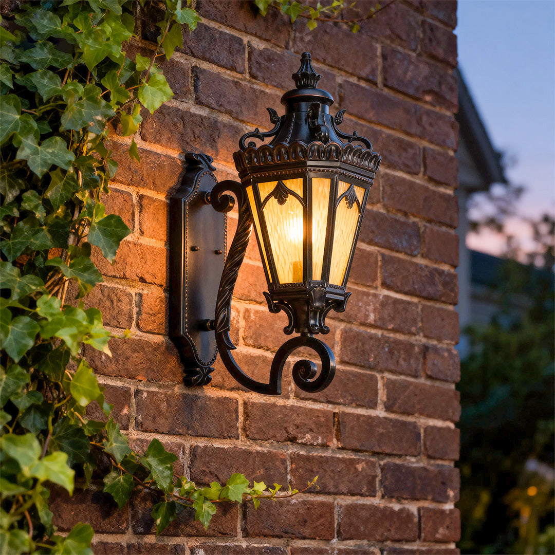 Wall mount light outdoor casting warm evening glow on red brick wall with blurred background