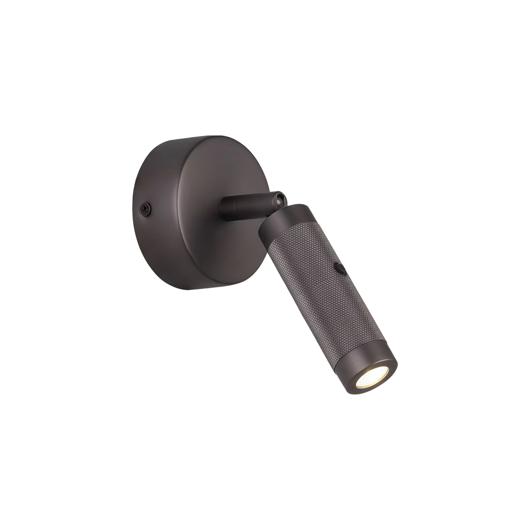 Black wall mount reading light with minimalist circular base and adjustable cylindrical spotlight fixture.