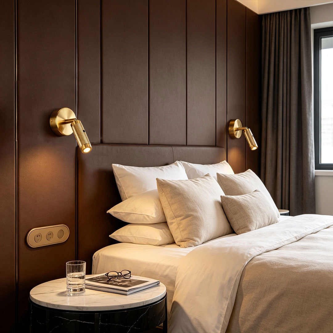 Elegant wall mount reading light featured in luxury bedroom with gold adjustable spotlight fixtures.