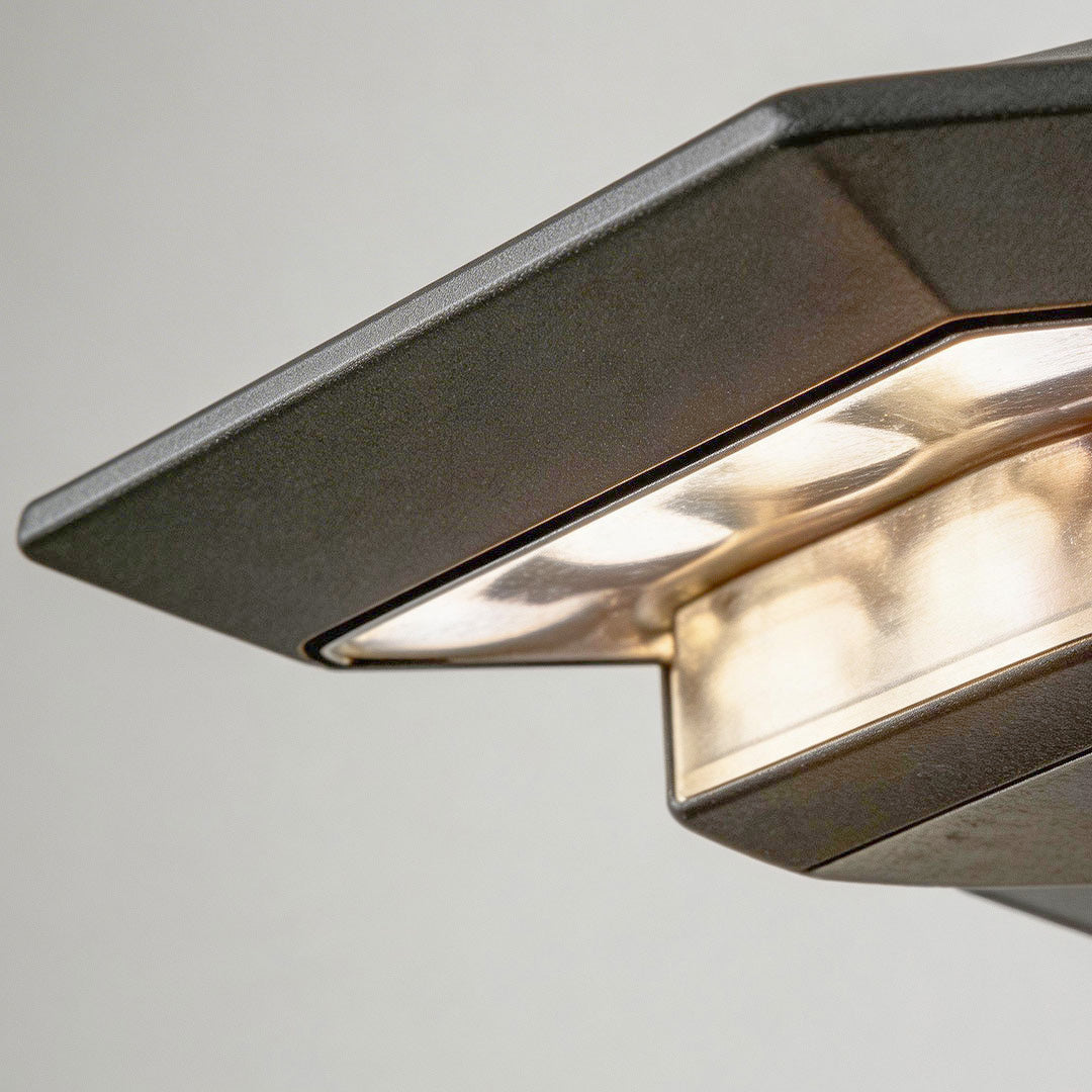 Wall mount solar lights outdoor with a rectangular design, illuminating a modern house facade.