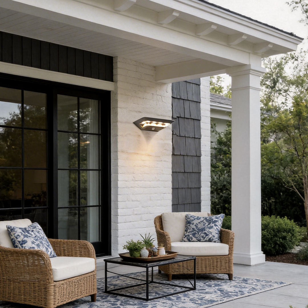 Wall mount solar lights outdoor with a sleek design, enhancing a patio seating area.