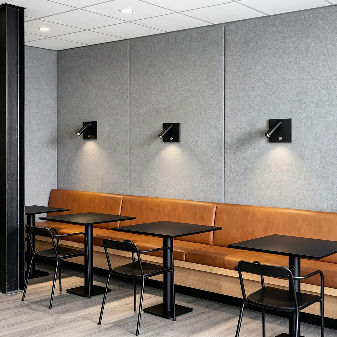 Stylish wall mountable reading light installed in restaurant seating area with modern spotlight fixtures.