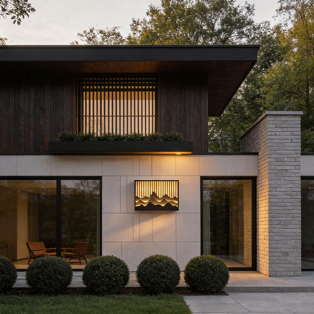 Wall mountain light illuminating a contemporary building entrance with warm light.
