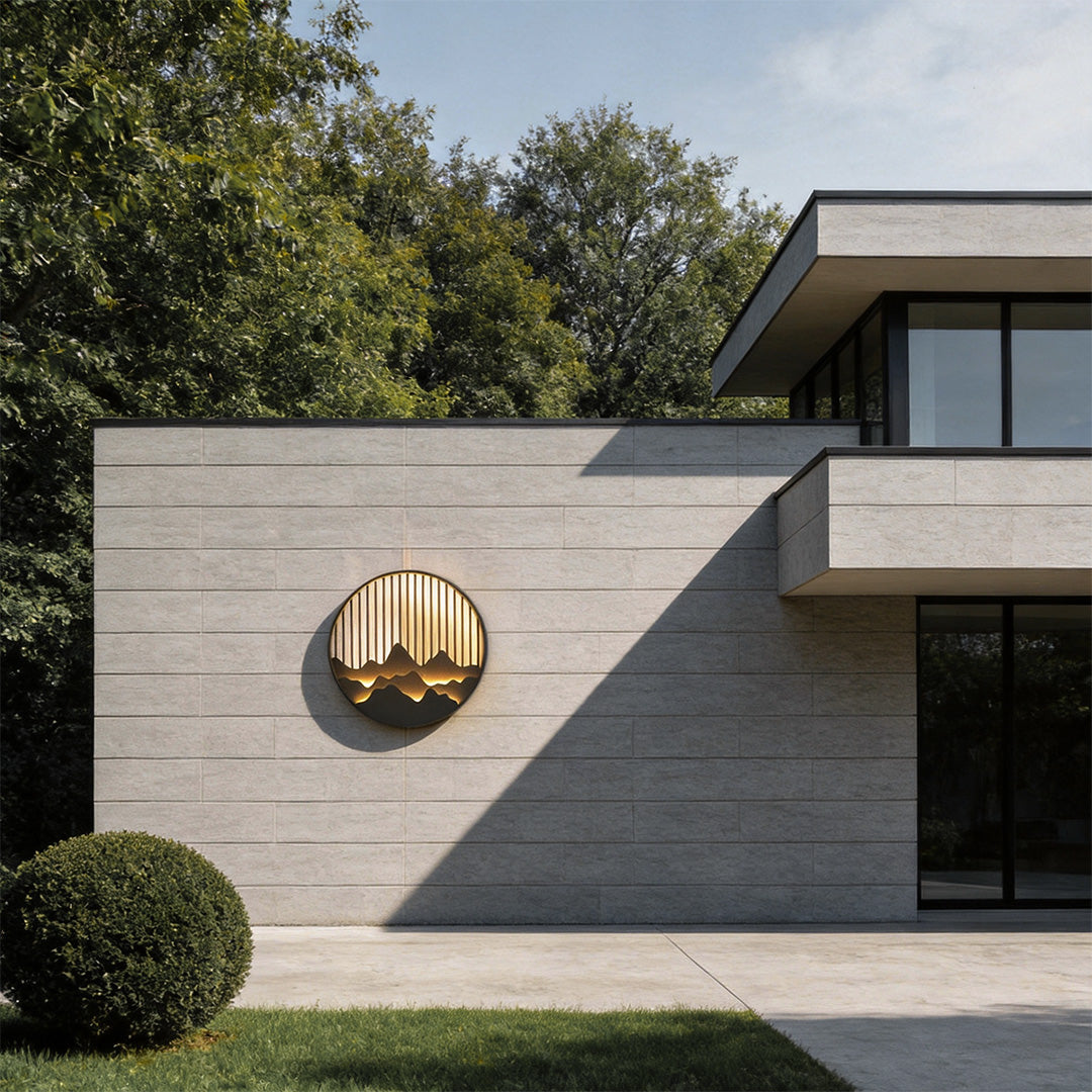 Wall mountain light adding a modern touch to a house exterior with circular design.