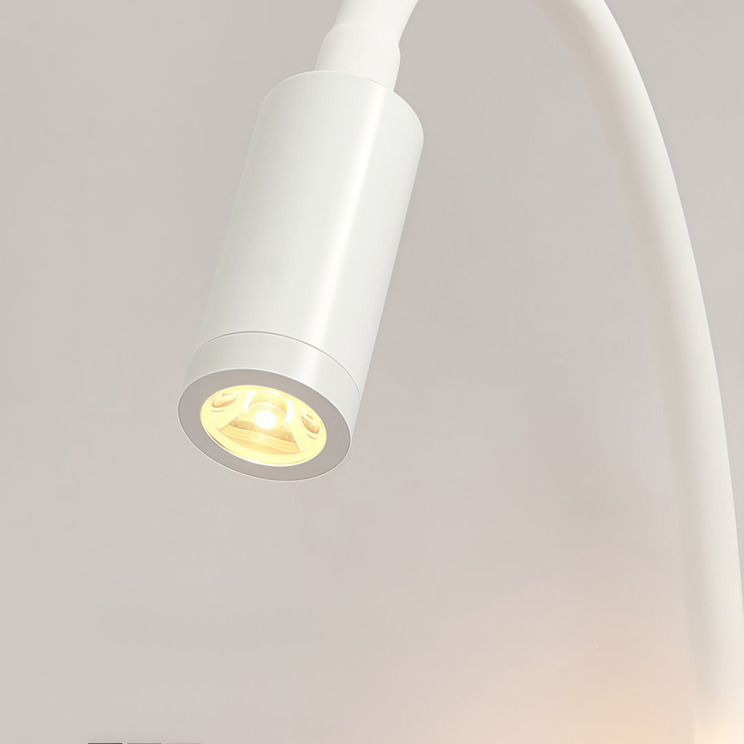 Detailed view of white wall mounted bedside light featuring flexible gooseneck reading spotlight.