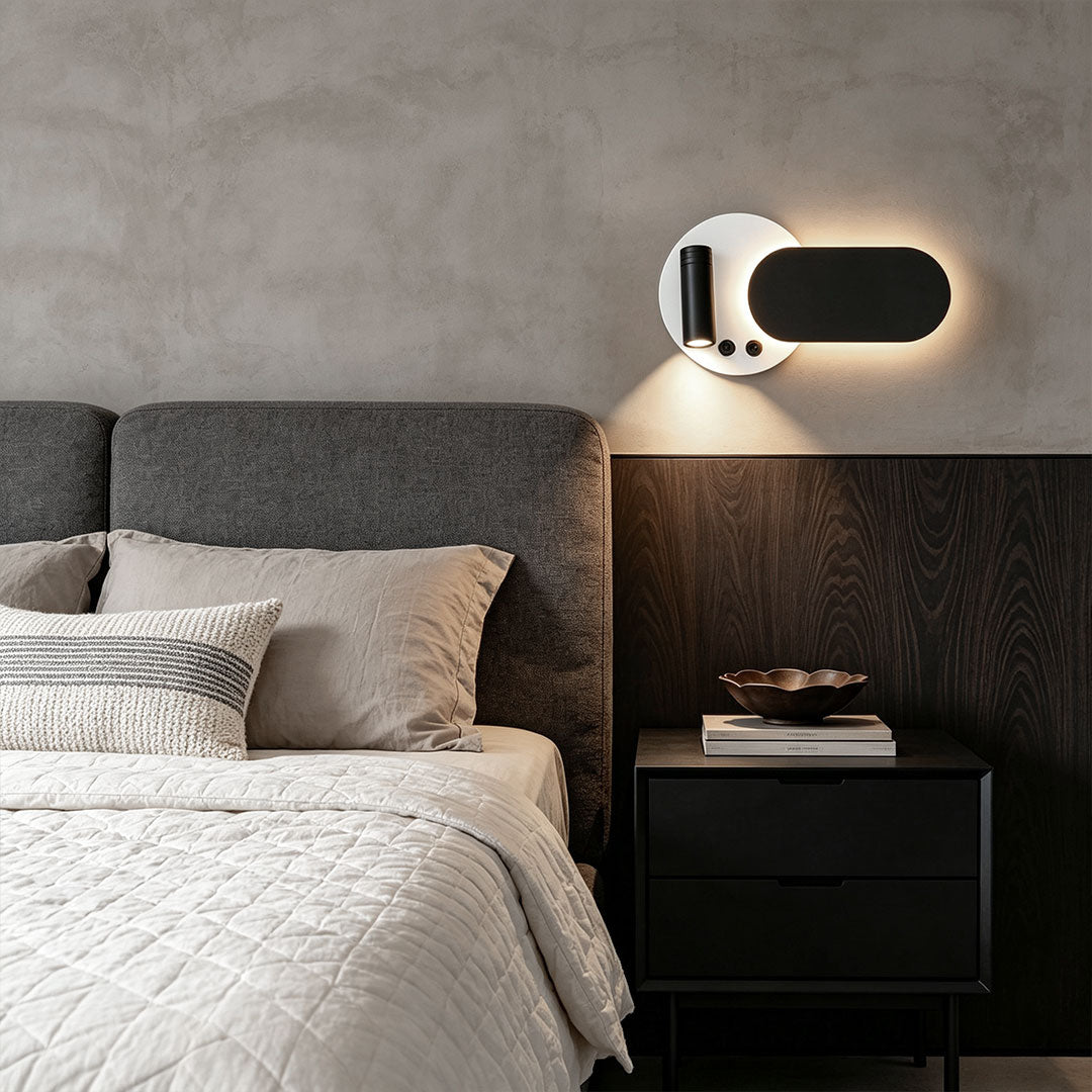 Stylish wall mounted bedside reading light beside bed featuring warm backlight and adjustable spotlight.