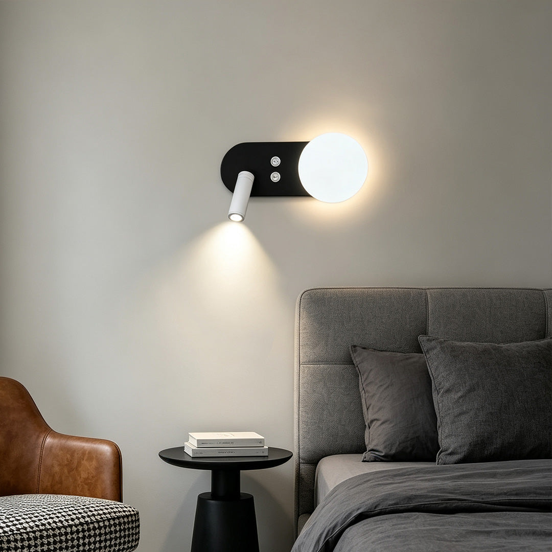 Modern wall mounted bedside reading light with adjustable spotlight and glowing orb in cozy living room.