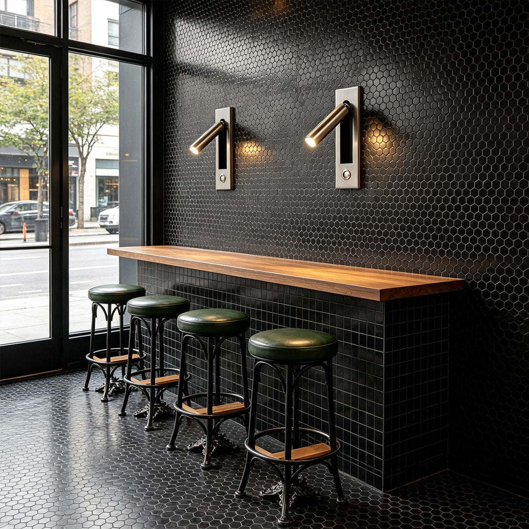 Elegant wall mounted LED lights illuminating modern bar interior with adjustable spotlight wall fixtures.