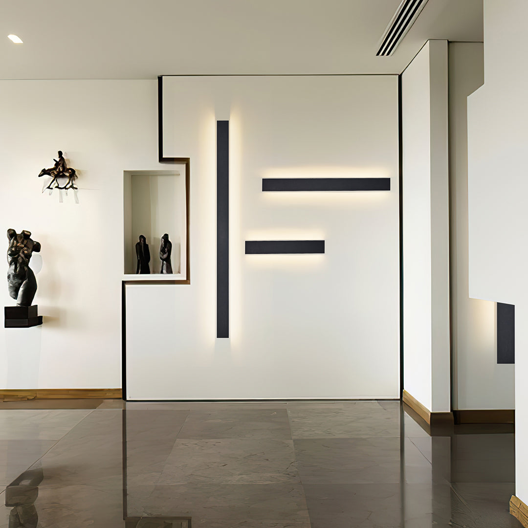 Wall mounted linear lights providing ambient glow in moody interior with lush tropical greenery