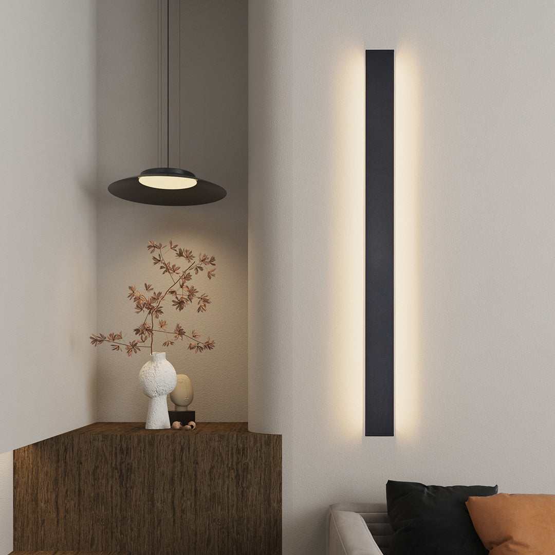 Wall mounted linear lights brightening modern white hallway with clean architectural lines