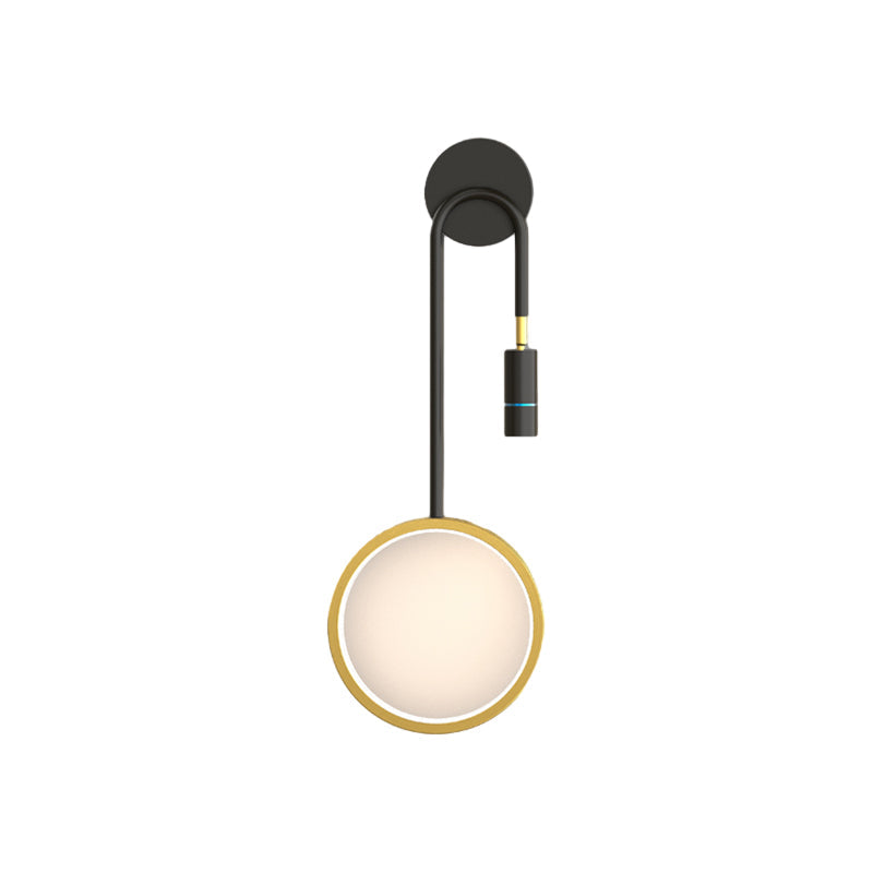 Wall pendant light with a black and gold design, showcasing its modern aesthetic.
