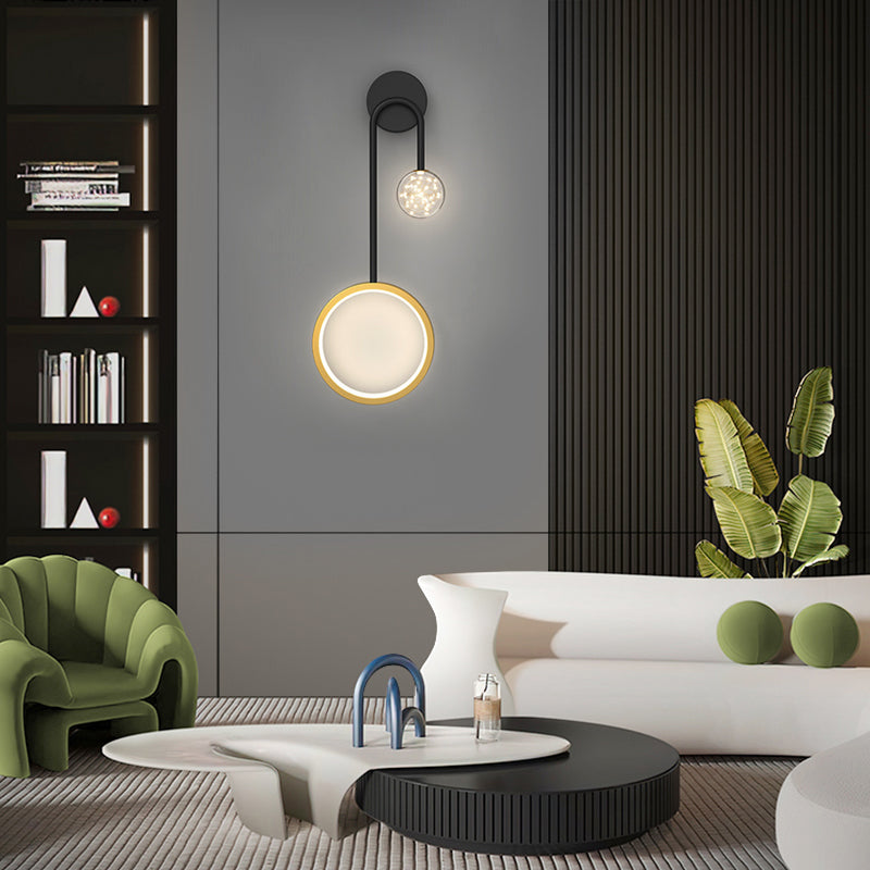 Wall pendant light adding elegance to a contemporary bedroom with a gray headboard.