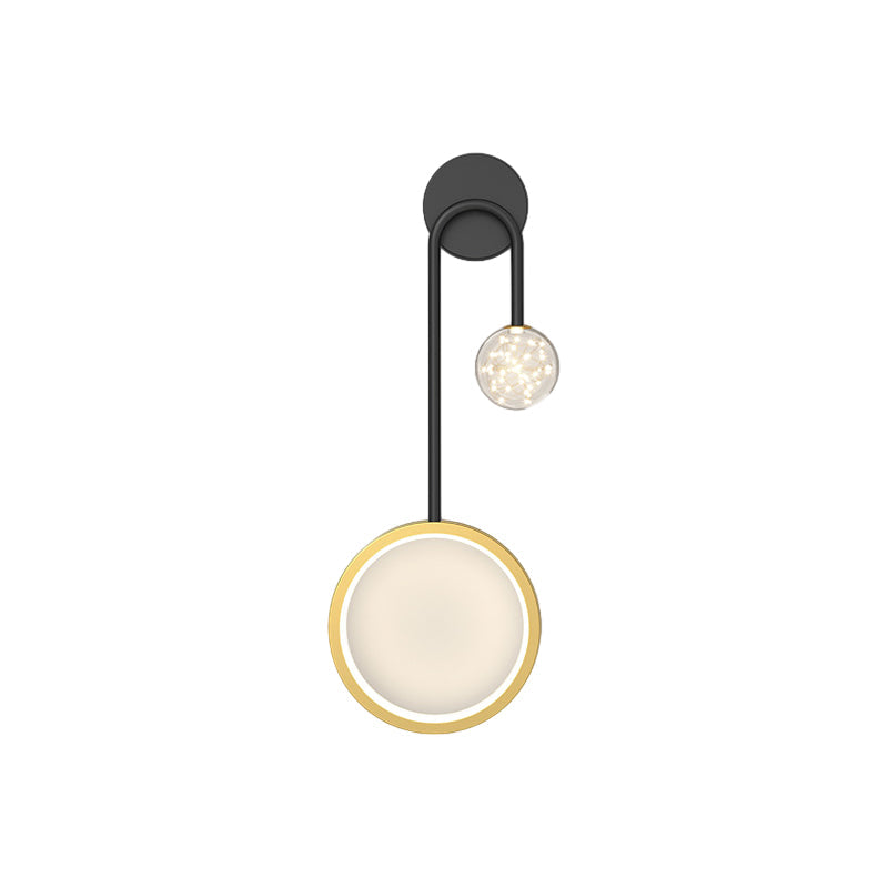 Wall pendant light with a gold ring detail, highlighting its contemporary style.