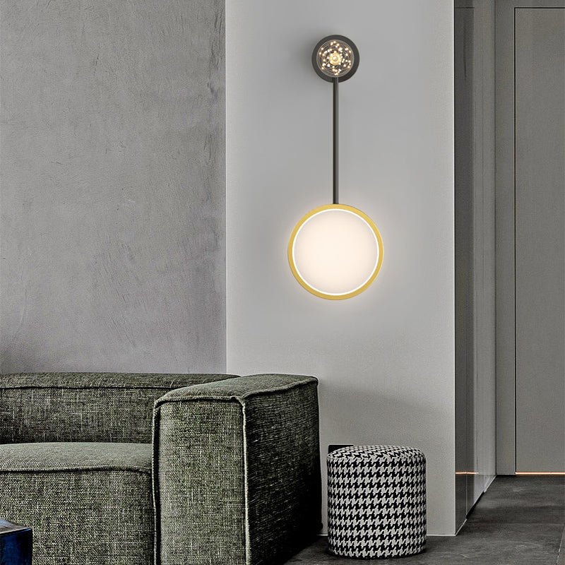 Wall pendant light enhancing a modern living room with a gray sofa and decorative pillows.