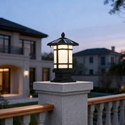 Wall pillar lights outdoor illuminating a modern garden pathway with warm, inviting glow.