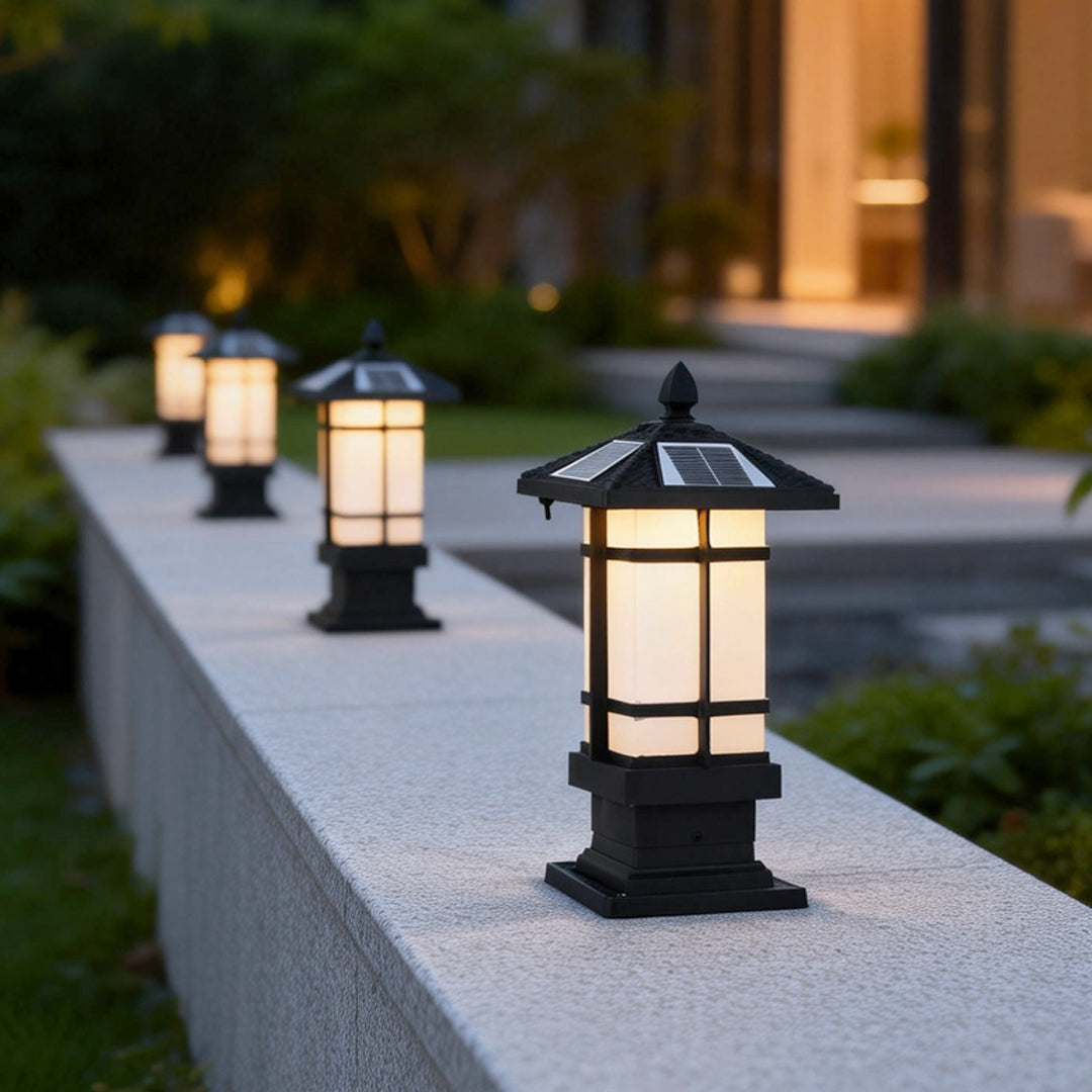 Wall pillar lights outdoor providing soft illumination along a residential driveway.