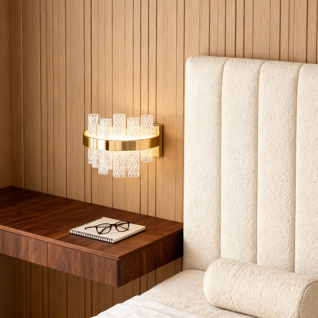 Wall sconce glass providing ambient lighting beside wooden nightstand in bedroom with natural wood slat wall paneling