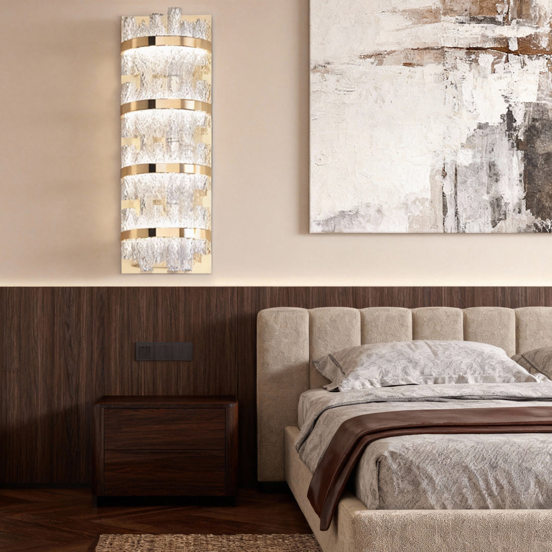 Wall sconce glass providing bedside lighting in sophisticated bedroom with dark wood furniture and textured wall treatments