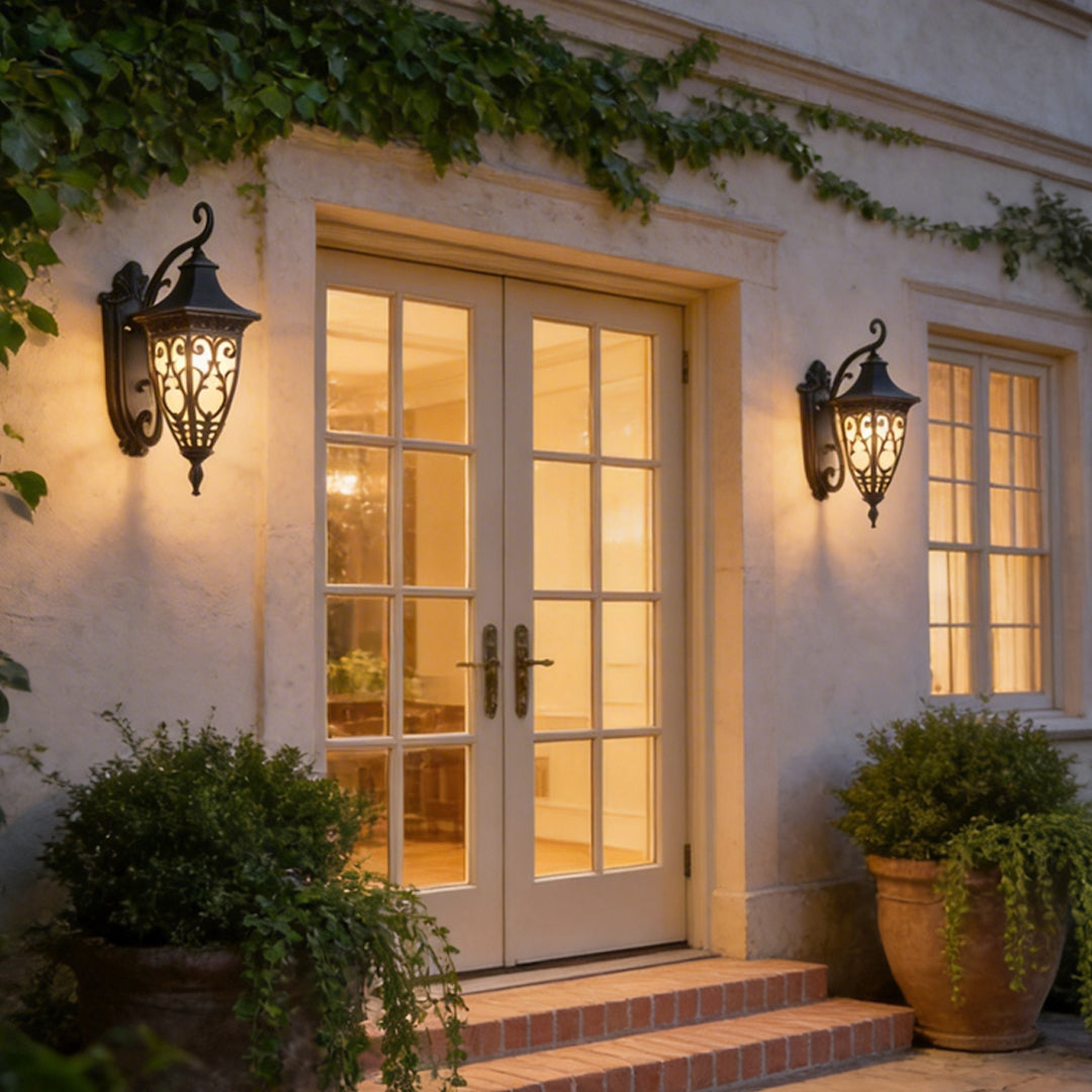 Wall sconce lantern with a vintage design, mounted beside a white door, providing warm illumination.
